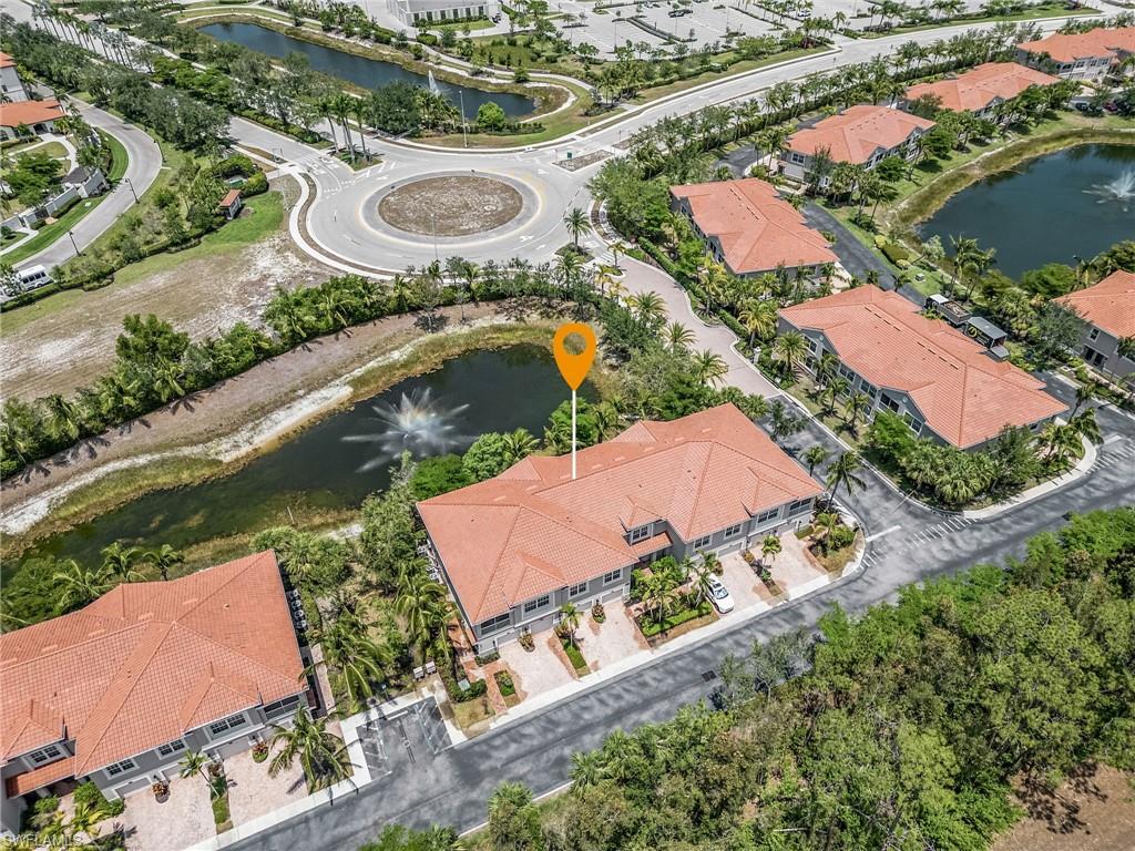 23550 Alamanda Drive, Unit 202 Estero, FL 34135 - Photo 23 of 26 an aerial view of residential houses with outdoor space