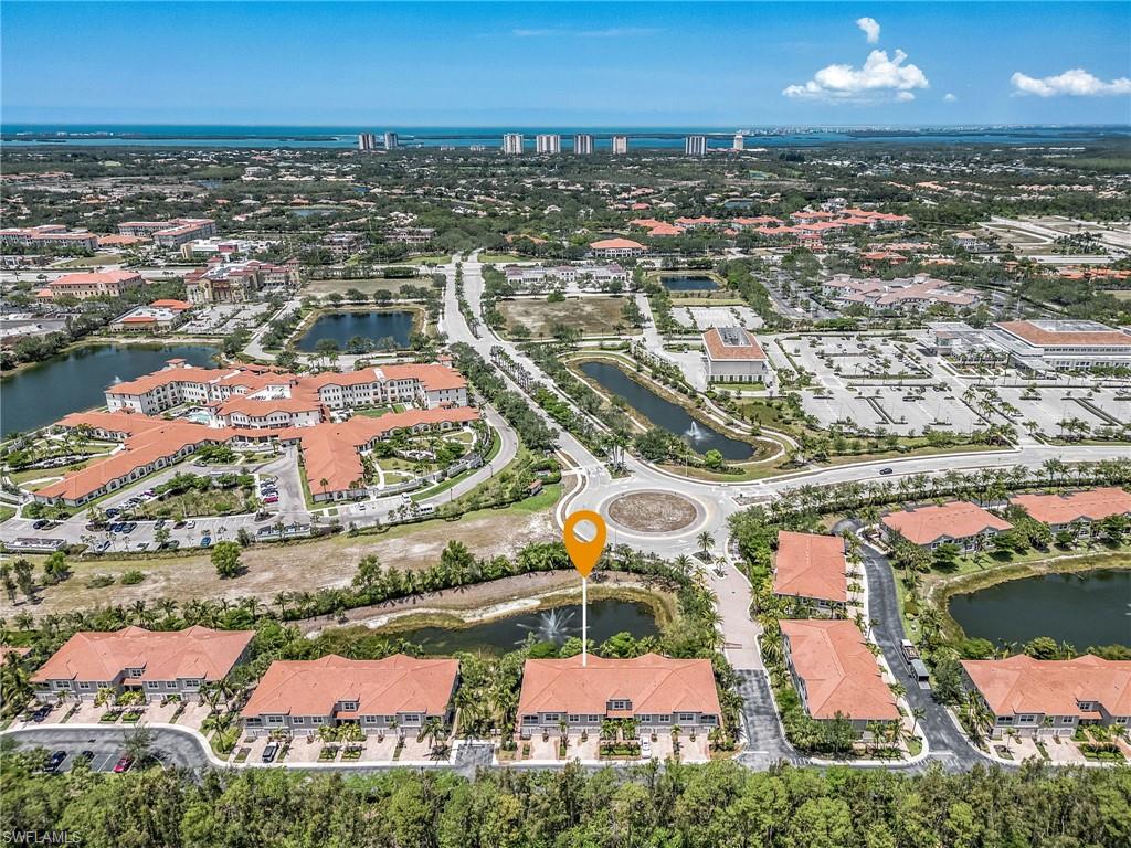 23550 Alamanda Drive, Unit 202 Estero, FL 34135 - Photo 24 of 26 an aerial view of residential houses with outdoor space