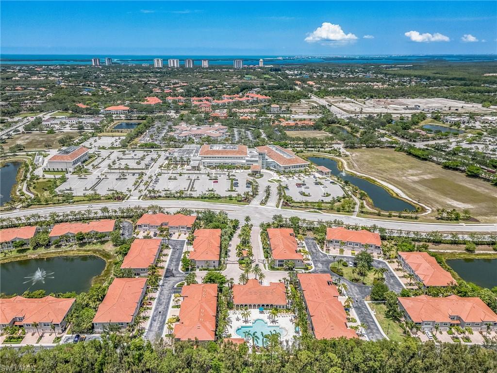 23550 Alamanda Drive, Unit 202 Estero, FL 34135 - Photo 25 of 26 an aerial view of residential houses with outdoor space