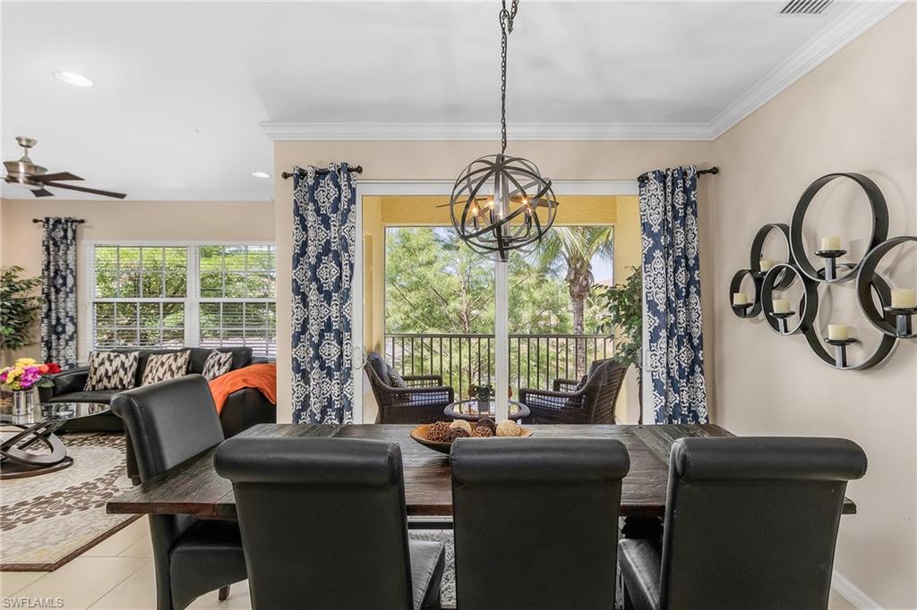 23550 Alamanda Drive, Unit 202 Estero, FL 34135 - Photo 10 of 26 a view of a dining room with furniture window and outside view