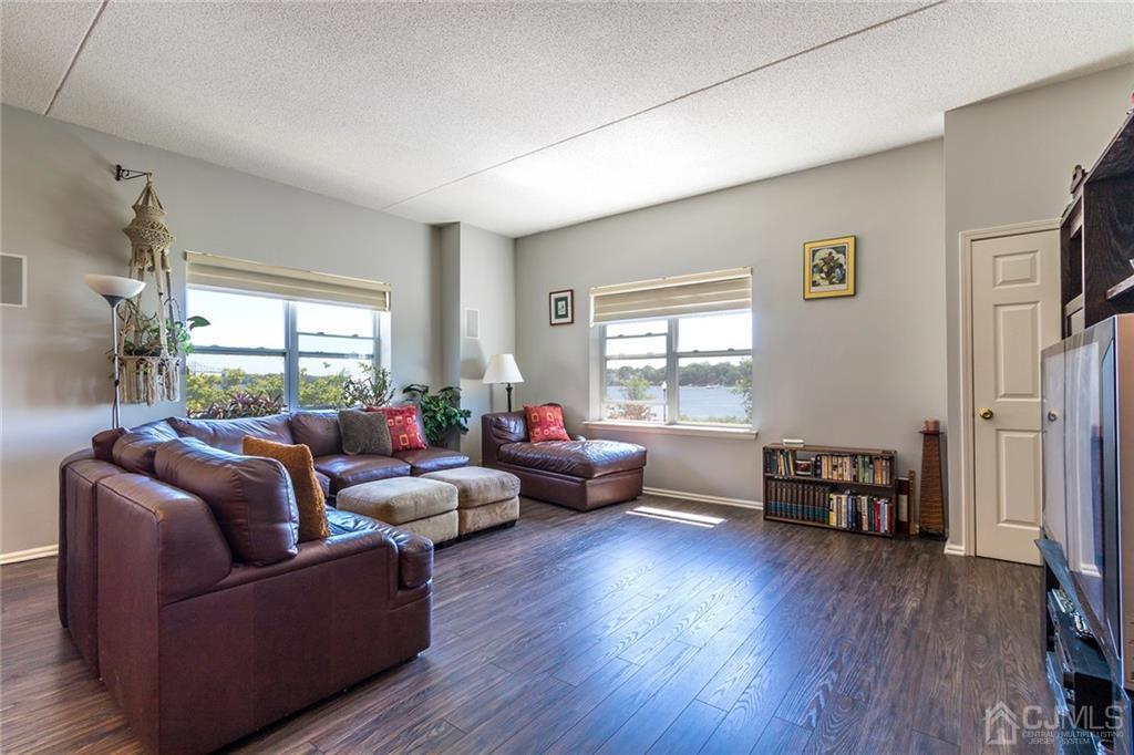 358 Rector Street, Unit 222 Perth Amboy, NJ 08861 - Photo 4 of 25 a living room with furniture and a wooden floor