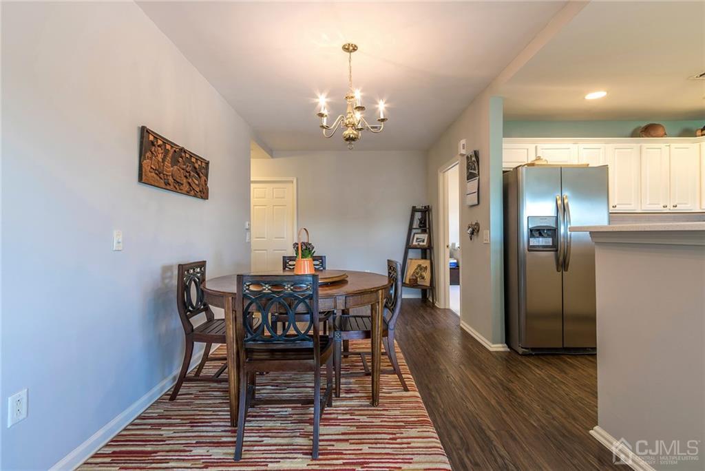 358 Rector Street, Unit 222 Perth Amboy, NJ 08861 - Photo 8 of 25 a view of a dining room with furniture and wooden floor