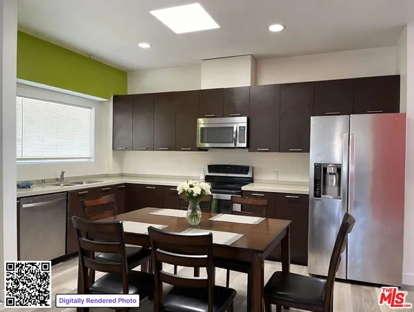 a kitchen with a sink a counter space and stainless steel appliances
