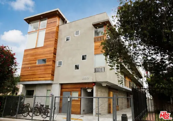 a view of a house with a tree