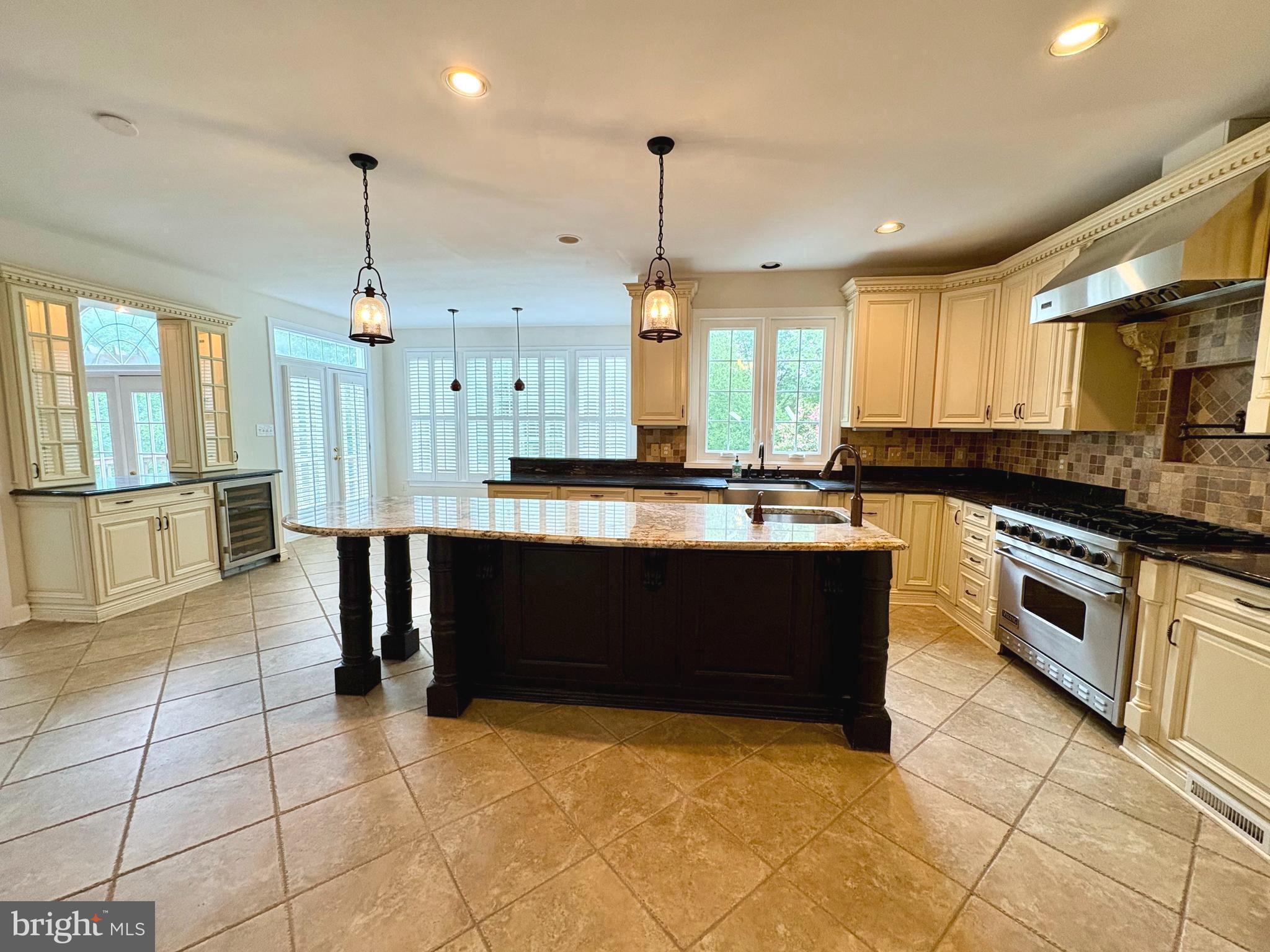 1151 Fieldview Drive Reston, VA 20194 - Photo 13 of 79 a large kitchen with granite countertop a stove a sink a counter space and cabinets