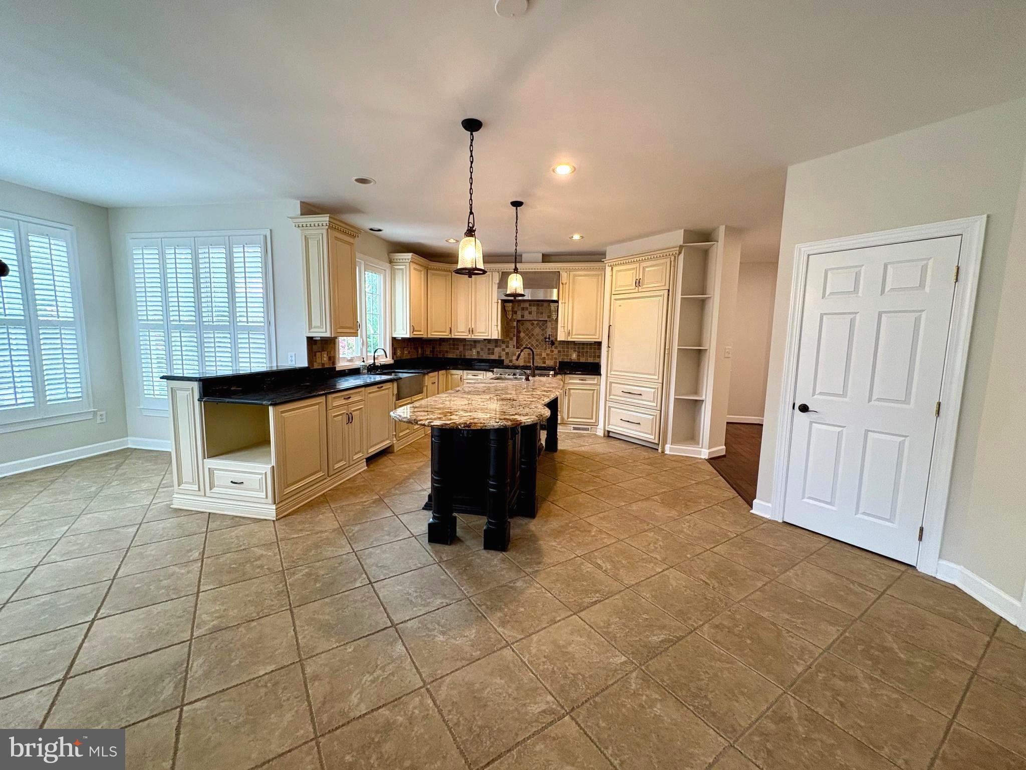 1151 Fieldview Drive Reston, VA 20194 - Photo 14 of 79 a large kitchen with granite countertop a stove a sink a counter space and cabinets