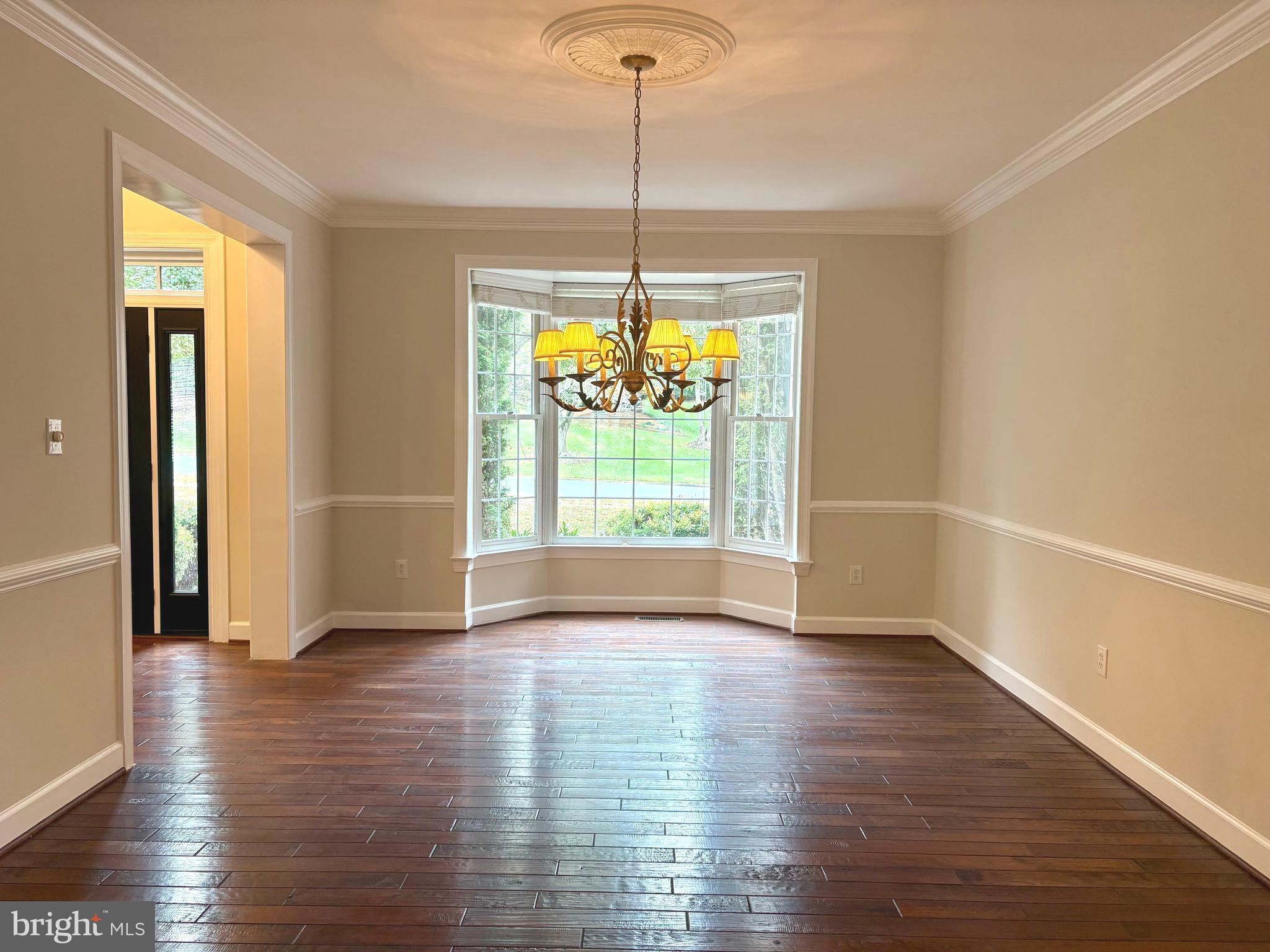 1151 Fieldview Drive Reston, VA 20194 - Photo 22 of 79 a view of an empty room with window and wooden floor