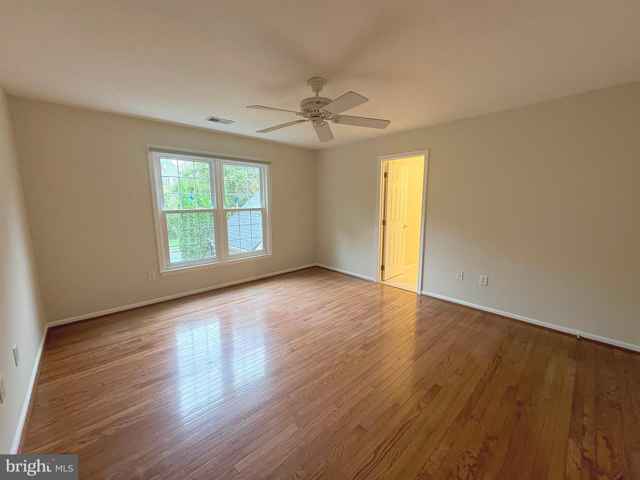 1151 Fieldview Drive Reston, VA 20194 - Photo 24 of 79 an empty room with wooden floor chandelier and windows