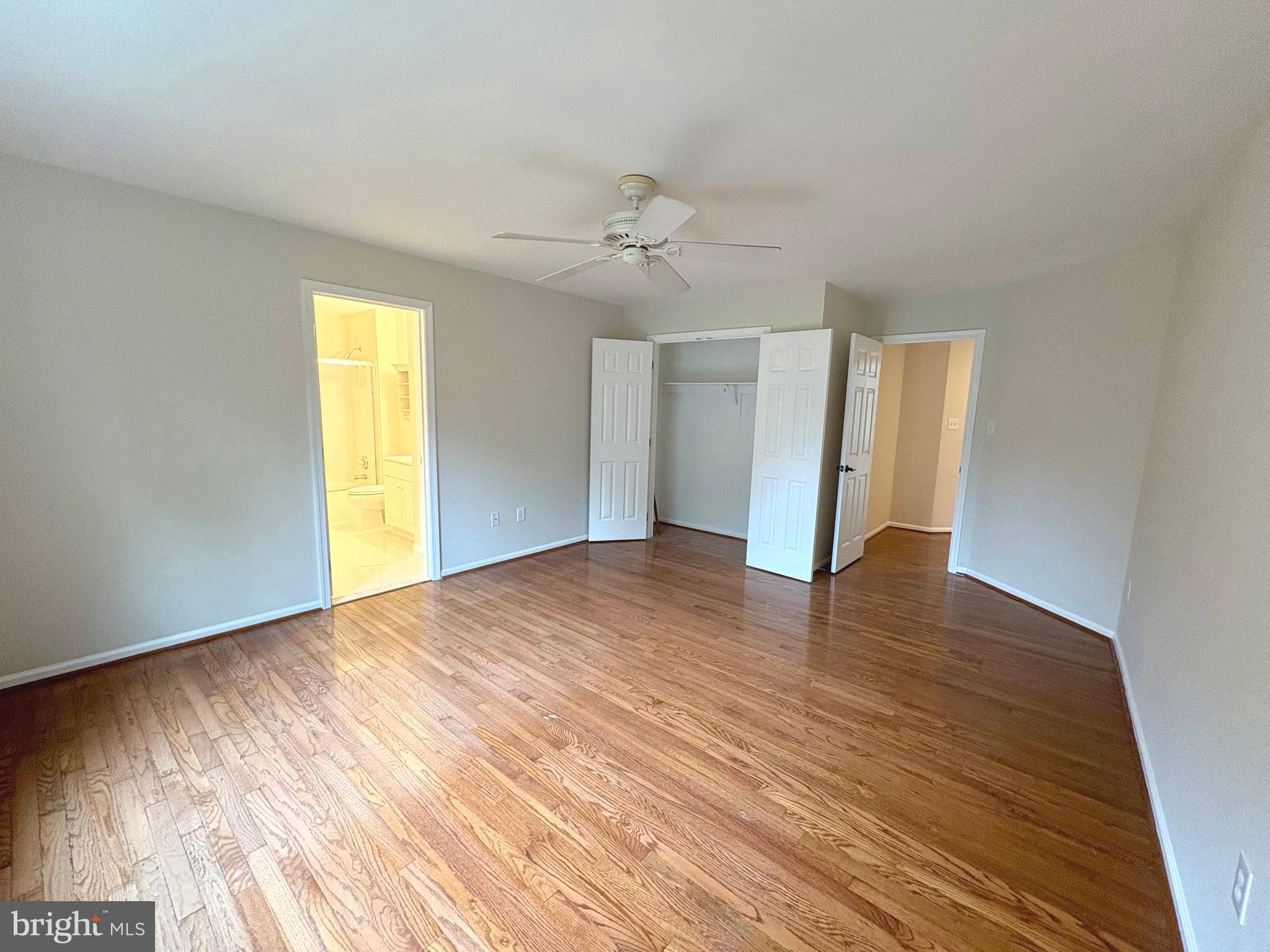1151 Fieldview Drive Reston, VA 20194 - Photo 25 of 79 an empty room with wooden floor ceiling fan and windows