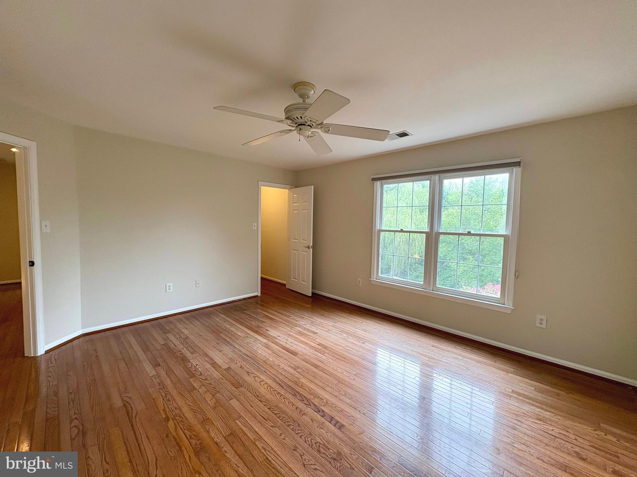 1151 Fieldview Drive Reston, VA 20194 - Photo 42 of 79 a view of an empty room with wooden floor and a window