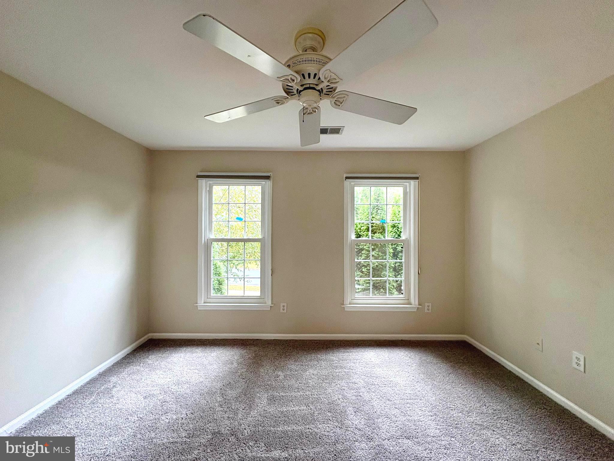 1151 Fieldview Drive Reston, VA 20194 - Photo 46 of 79 an empty room with windows and fan