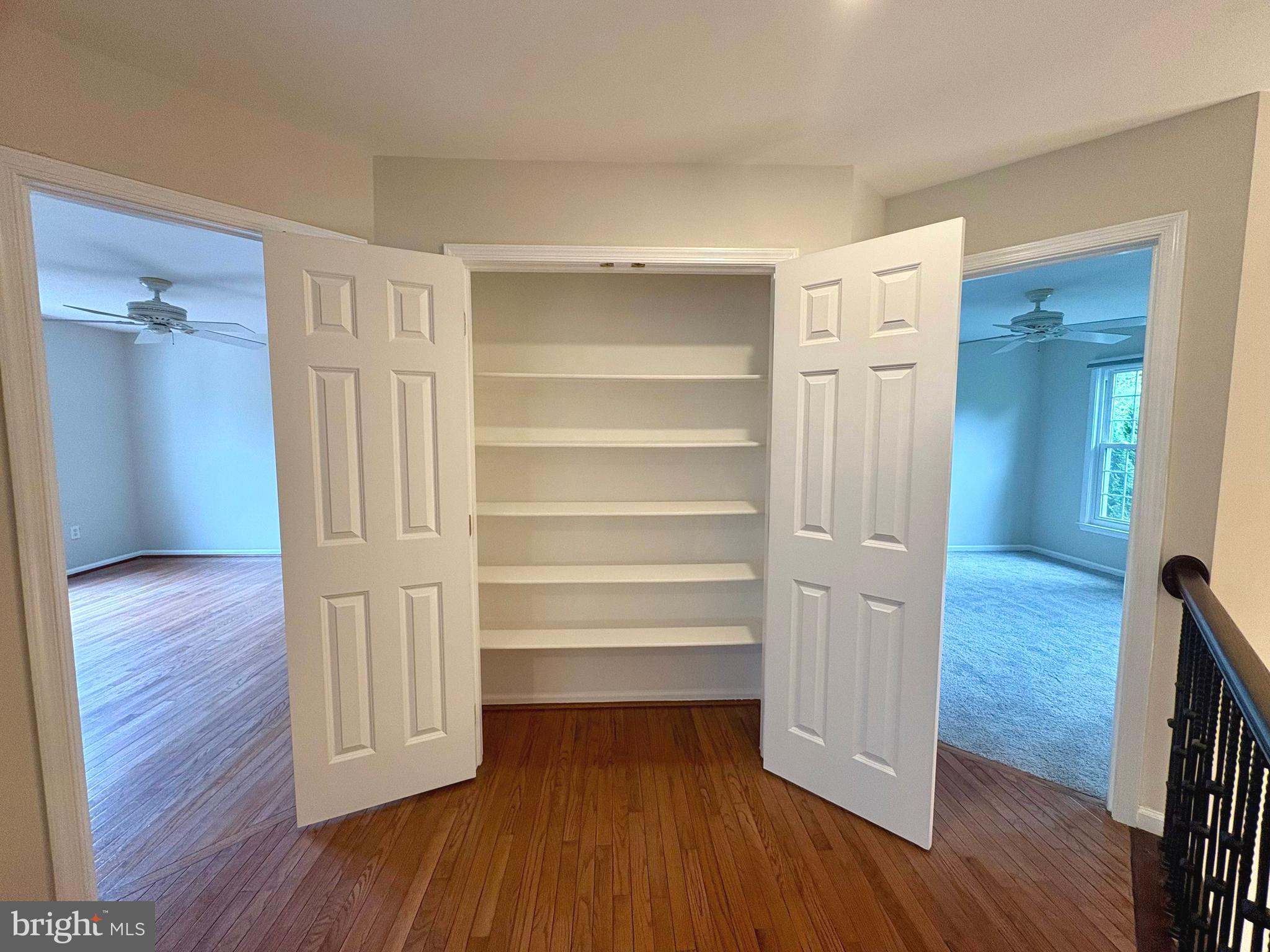 1151 Fieldview Drive Reston, VA 20194 - Photo 48 of 79 a view of walk in closet with wooden floor and closet
