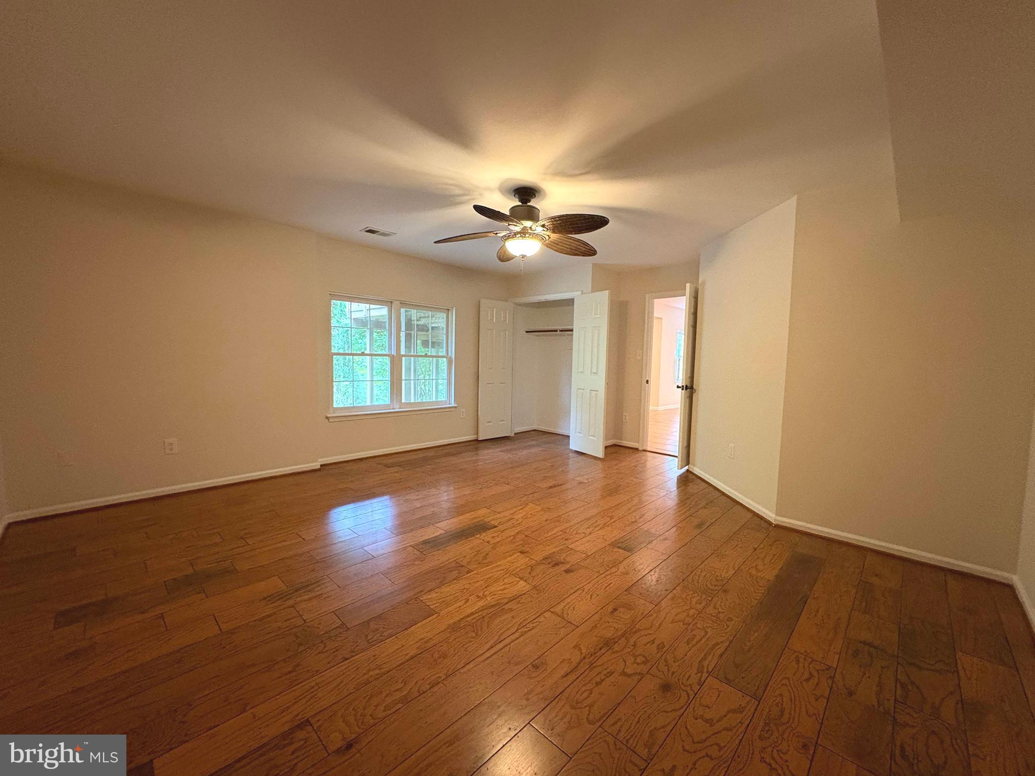 1151 Fieldview Drive Reston, VA 20194 - Photo 58 of 79 a view of an empty room with window and wooden floor
