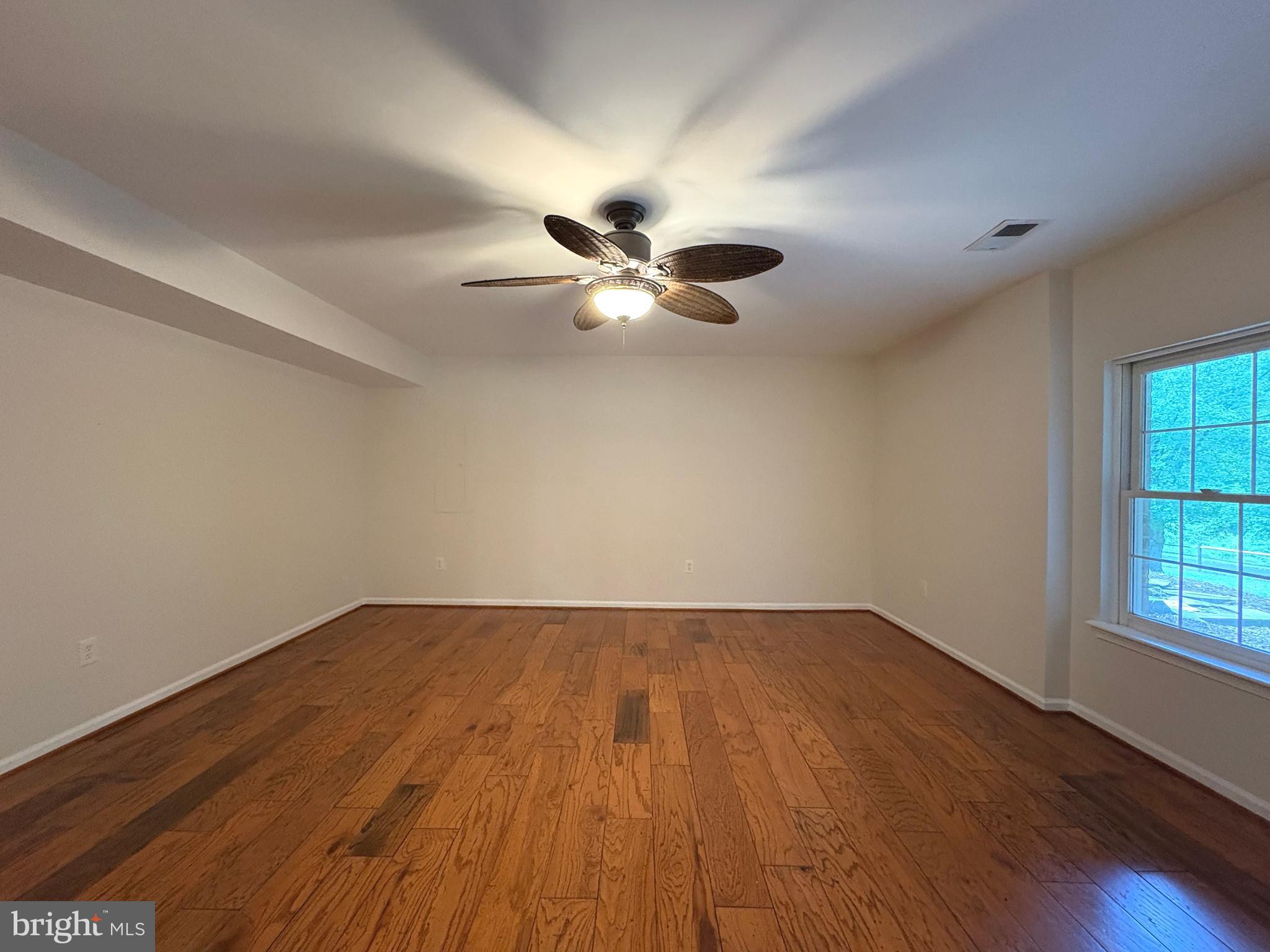 1151 Fieldview Drive Reston, VA 20194 - Photo 59 of 79 wooden floor in an empty room with a window