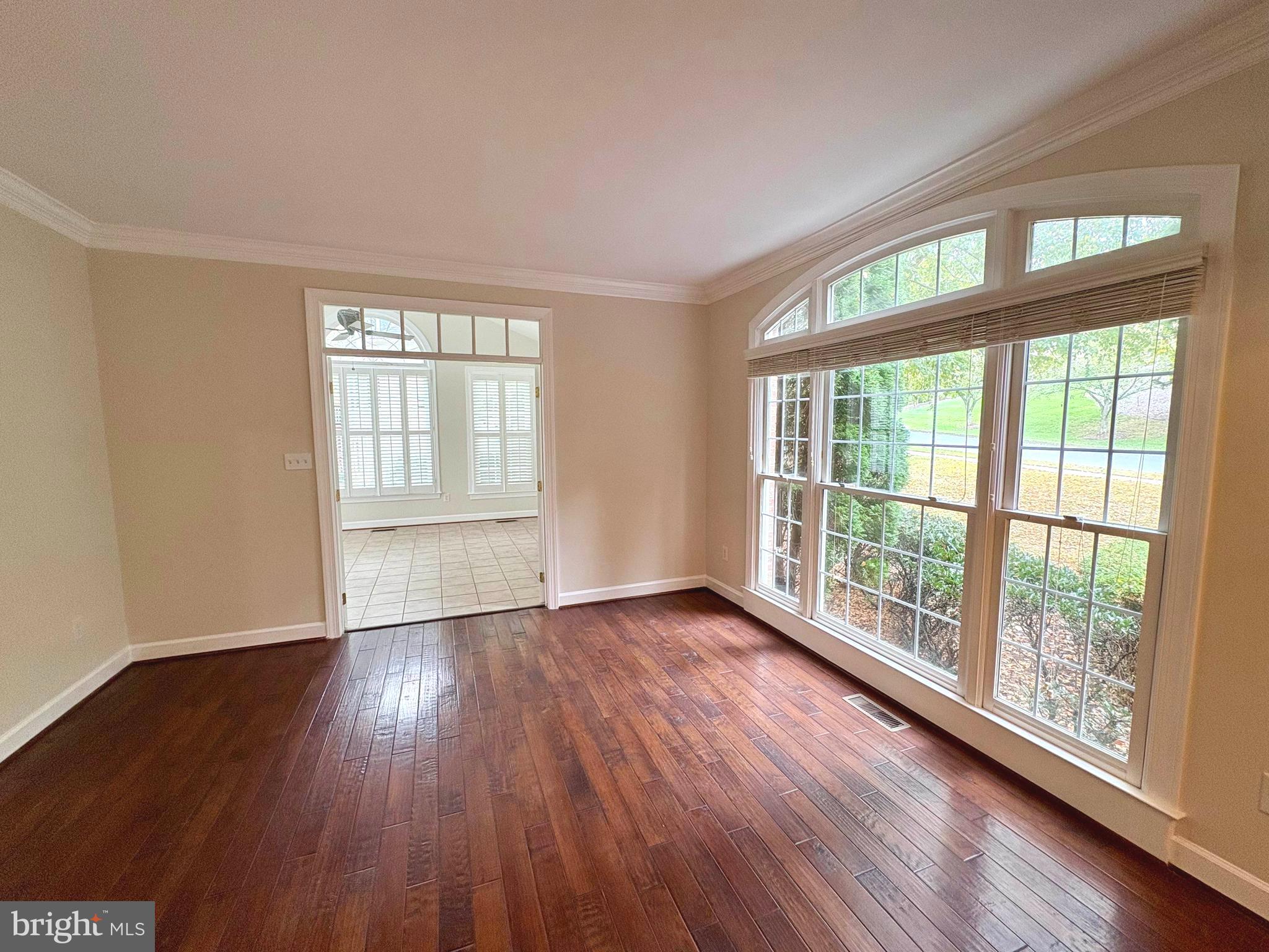 1151 Fieldview Drive Reston, VA 20194 - Photo 7 of 79 a view of an empty room with wooden floor and a window