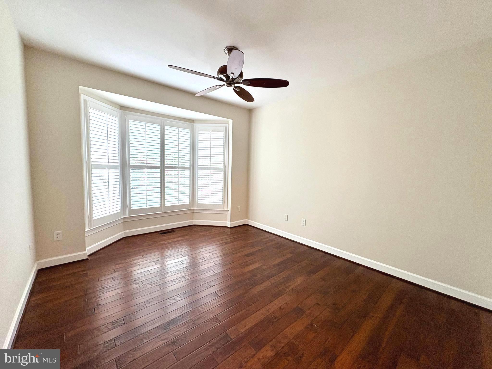 1151 Fieldview Drive Reston, VA 20194 - Photo 10 of 79 wooden floor in an empty room with a window