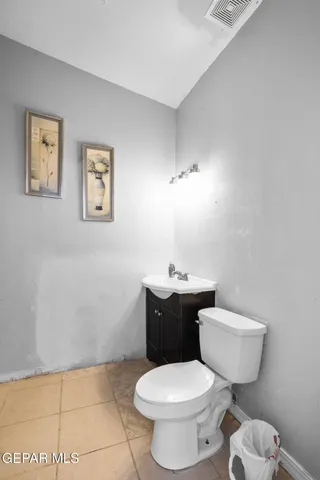 a living room with furniture potted plant and window