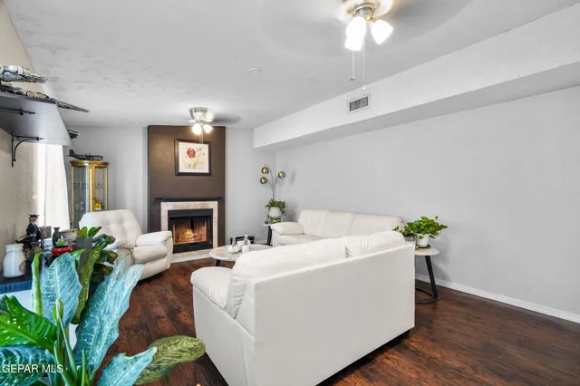 a kitchen with stainless steel appliances granite countertop a refrigerator a stove and a sink