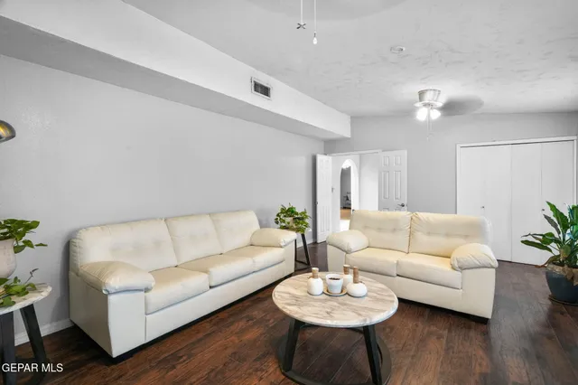 a kitchen with a stove a refrigerator and a microwave