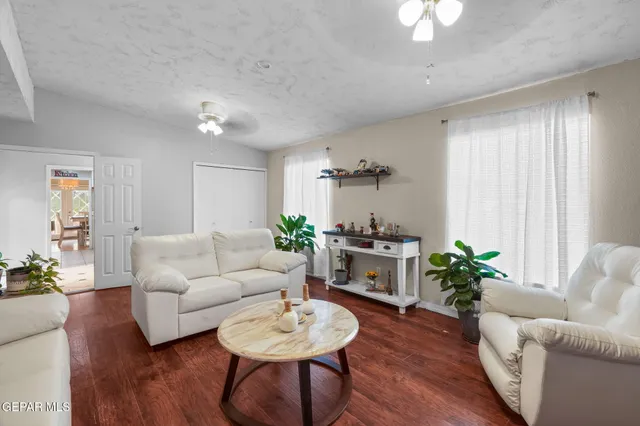 a kitchen with stainless steel appliances granite countertop a sink and a refrigerator
