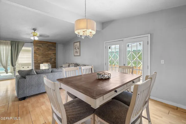 a spacious bedroom with a bed a couch and a window