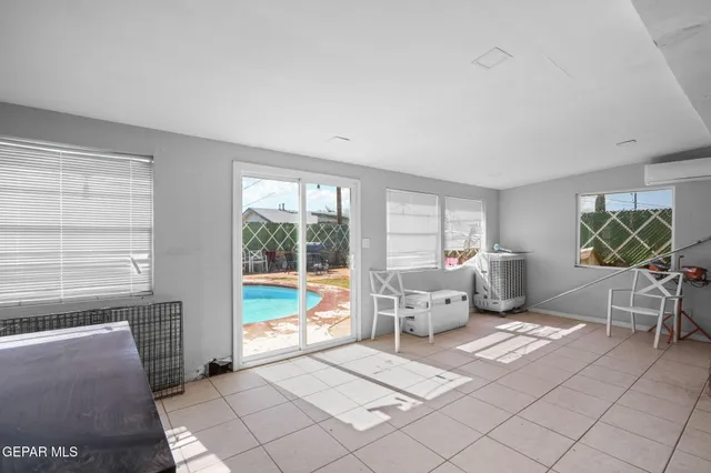 a view of a livingroom with furniture and a flat screen tv