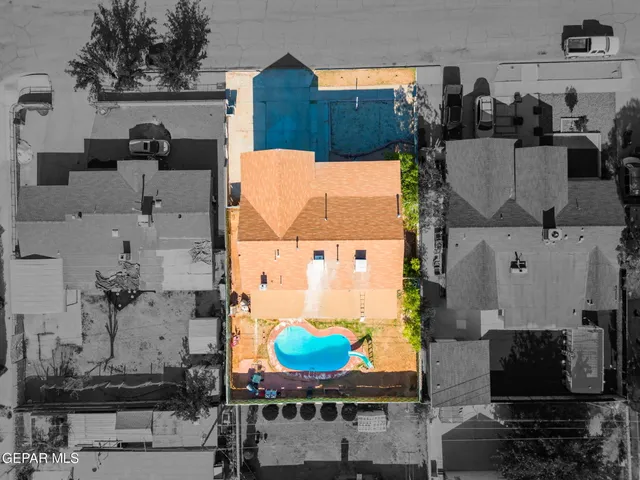 an aerial view of a house with swimming pool