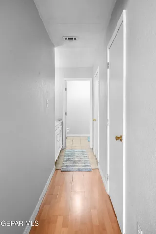 a view of a terrace with lawn chairs and a ocean view