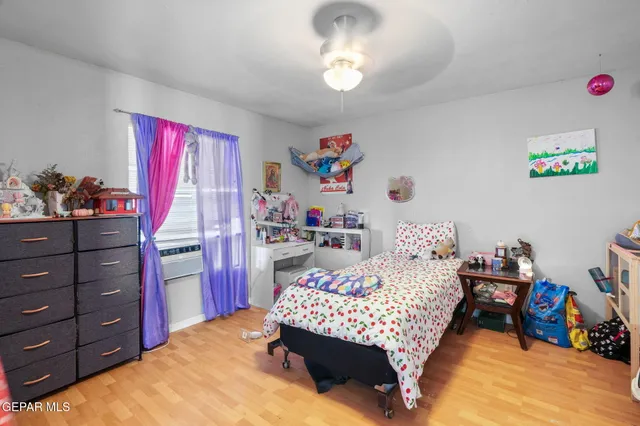 an aerial view of residential building and car parked