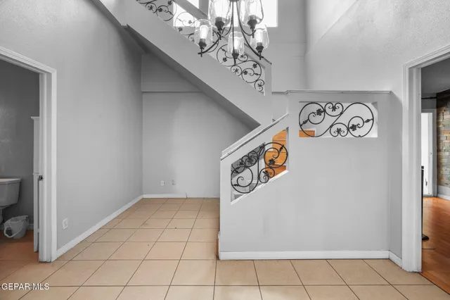 a living room with furniture potted plant and a fireplace