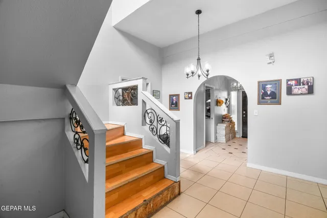 a living room with furniture potted plant and a fireplace