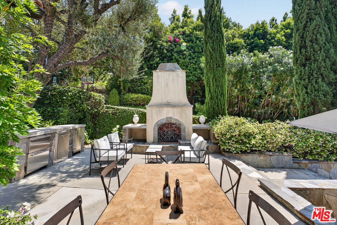 760 South San Rafael Avenue Pasadena, CA 91105 - Photo 6 of 45 a view of a chairs and table in backyard