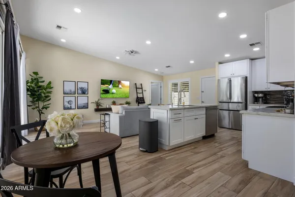 a kitchen with a table and chairs in it