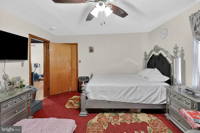a bedroom with furniture and a chandelier