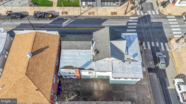 an aerial view of a house with a lake view