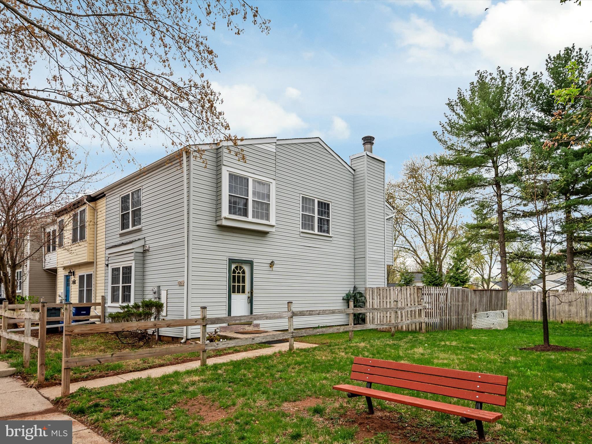 a view of a backyard with sitting area
