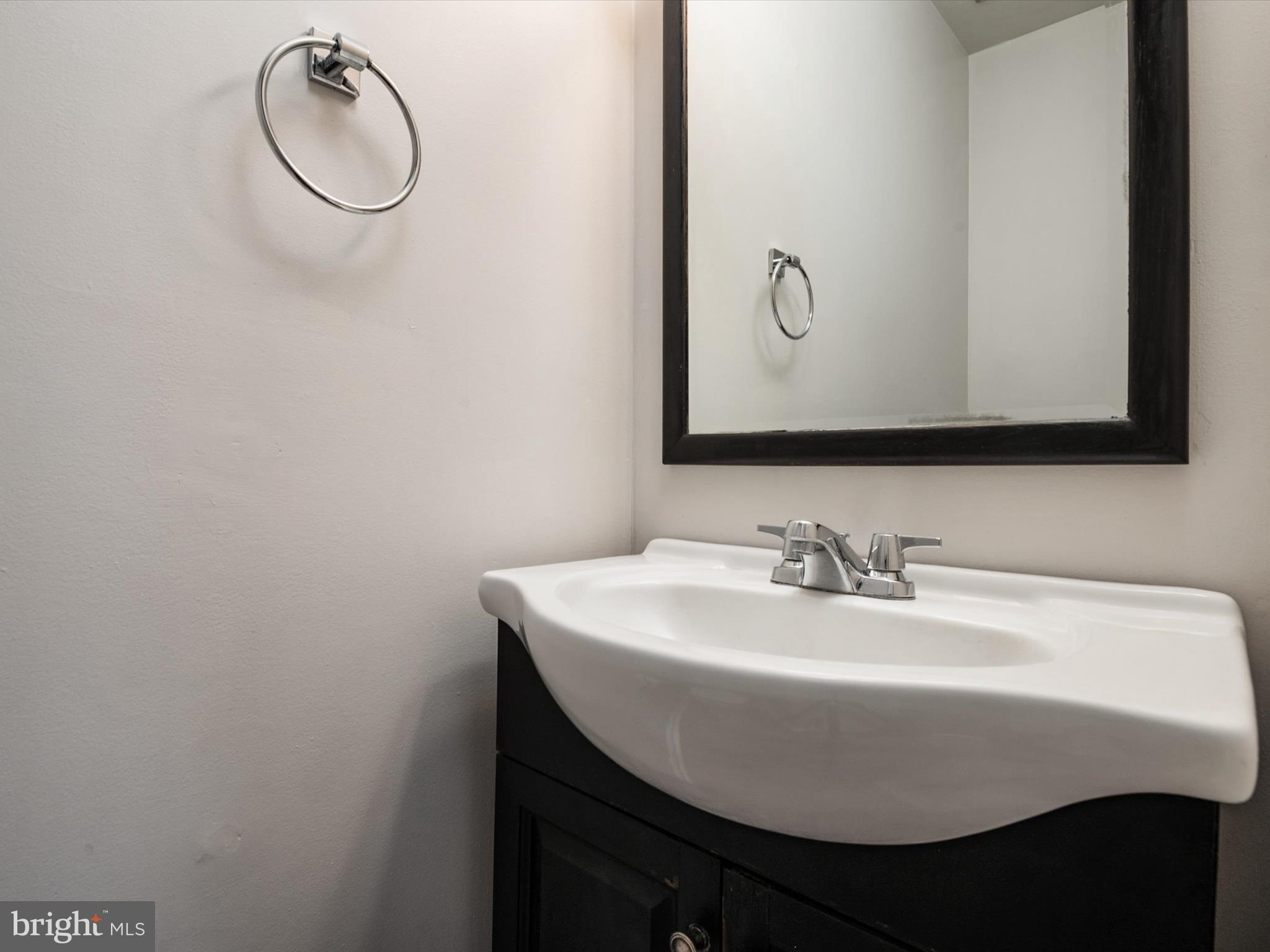 17422 Hoskinson Road Poolesville, MD 20837 - Photo 6 of 35 a bathroom with a sink and mirror