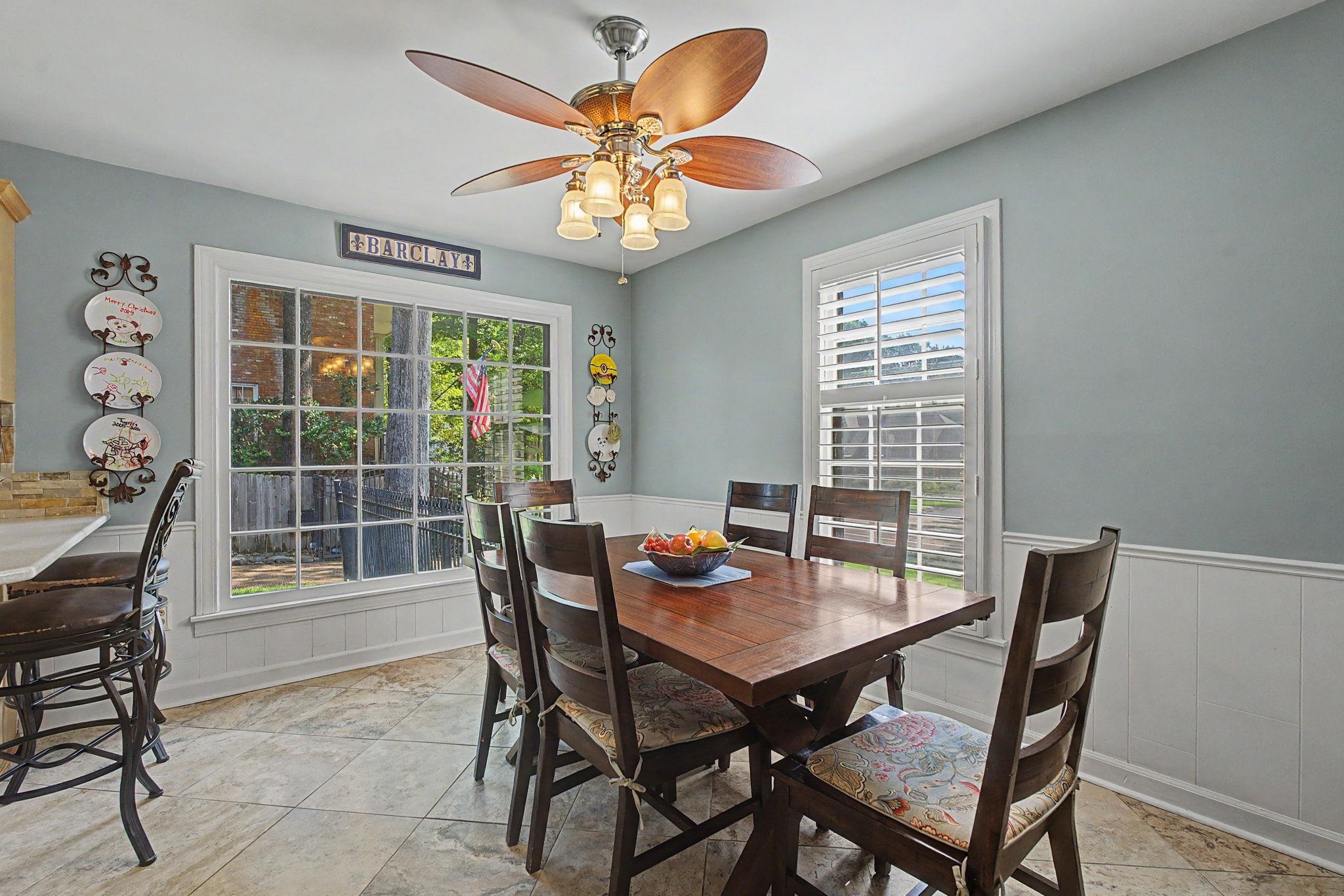 1929 Miller Farms Road Germantown, TN 38138 - Photo 13 of 40 Dining area featuring a large window with grid panes and a second window with plantation shutters