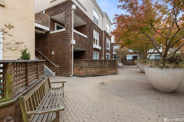 a view of a patio with a bench