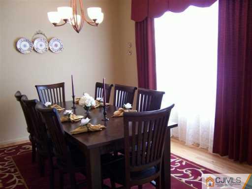 75 Stratton Road Old Bridge, NJ 07747 - Photo 2 of 8 a view of a dining room with furniture