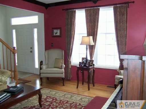 75 Stratton Road Old Bridge, NJ 07747 - Photo 3 of 8 a living room with furniture and a window
