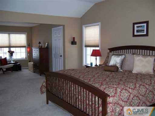 75 Stratton Road Old Bridge, NJ 07747 - Photo 4 of 8 a bedroom with a bed and window