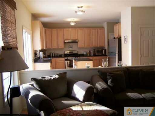 75 Stratton Road Old Bridge, NJ 07747 - Photo 6 of 8 a living room with furniture and a window