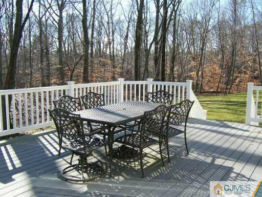 75 Stratton Road Old Bridge, NJ 07747 - Photo 8 of 8 a view of balcony with wooden floor and outdoor seating