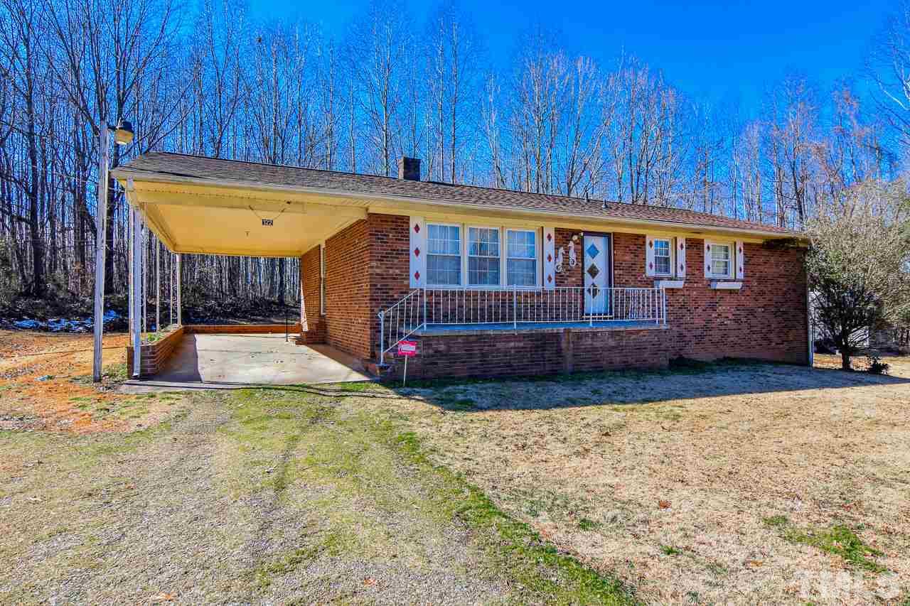 122 Henderson Road Roxboro, NC 27573 - Photo 1 of 27 a view of a house with a yard