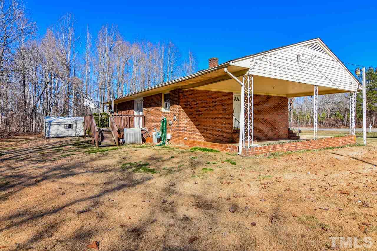 122 Henderson Road Roxboro, NC 27573 - Photo 14 of 27 a view of a house with a backyard