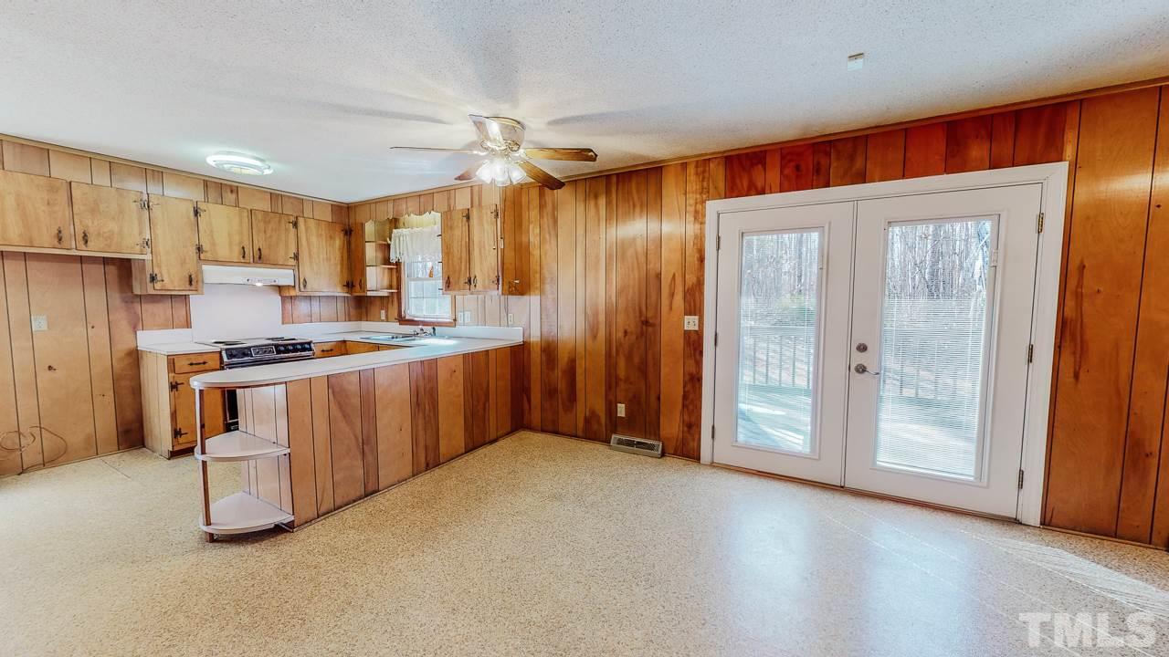 122 Henderson Road Roxboro, NC 27573 - Photo 3 of 27 a kitchen with stainless steel appliances granite countertop a refrigerator and a stove top oven
