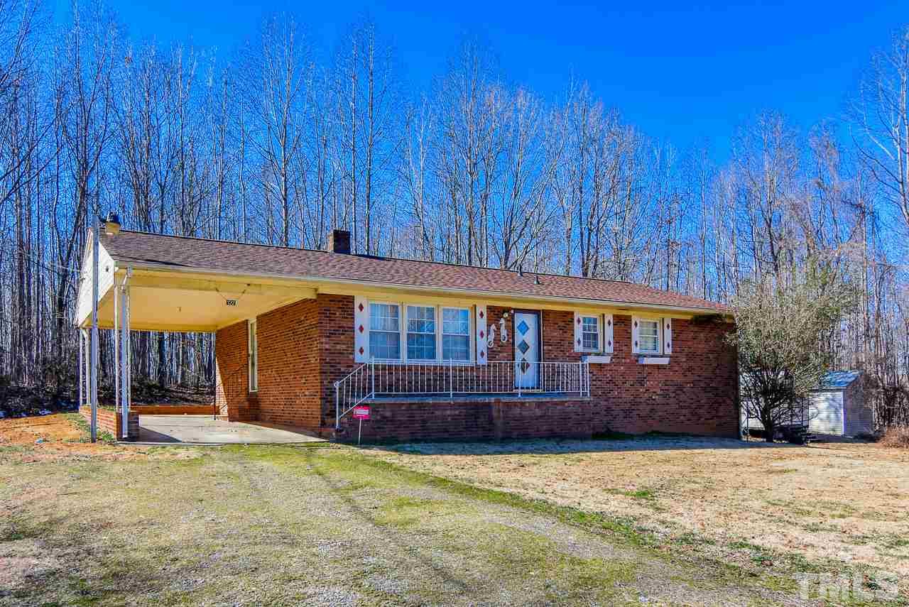 122 Henderson Road Roxboro, NC 27573 - Photo 22 of 27 a front view of house with yard