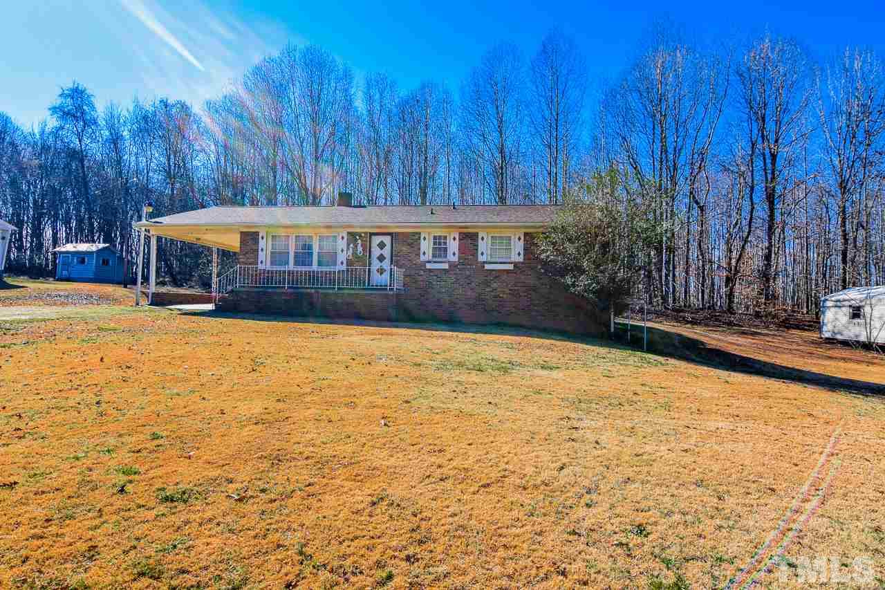 122 Henderson Road Roxboro, NC 27573 - Photo 23 of 27 a view of swimming pool with trees in the background