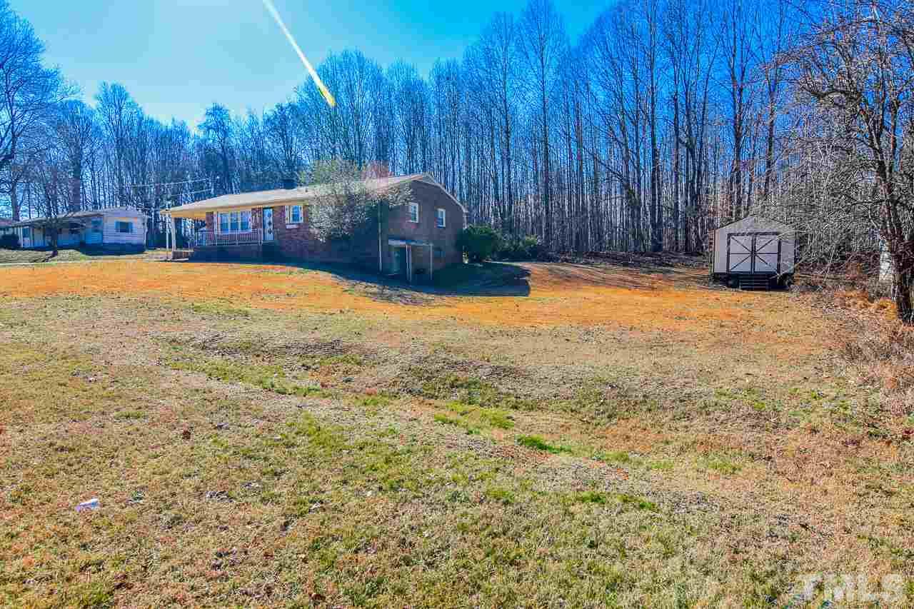 122 Henderson Road Roxboro, NC 27573 - Photo 24 of 27 a view of a backyard